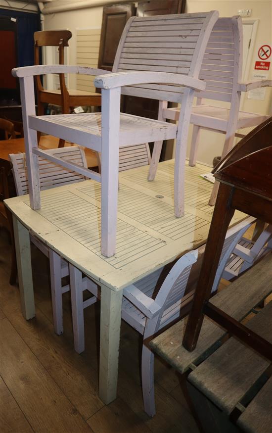 A painted garden table and six chairs Table L.151cm